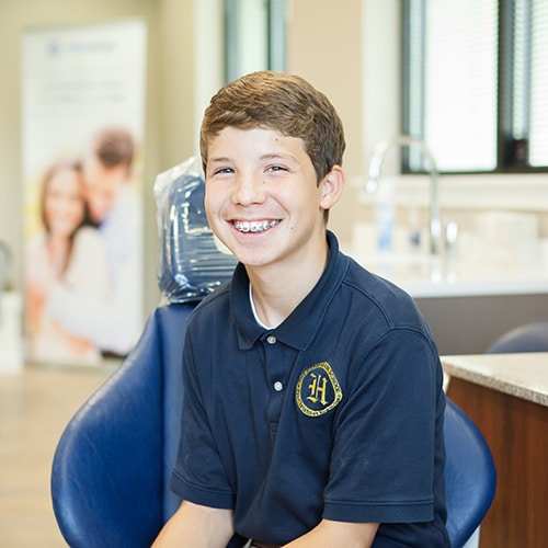 Teen with braces Vaught Orthodontics in Savannah and Richmond Hill, GA